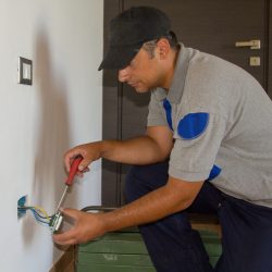 image-handyman-electrician-repairing-installing-home-electrical-outlet-diy-works