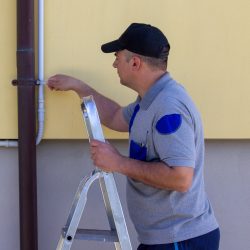 image-handyman-stepladder-assembling-gutter-channel-doityourself-jobs-home